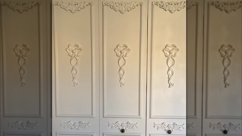 vintage closet doors with decorative millwork