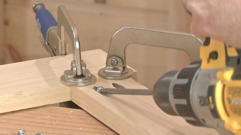 Person joining 1-inch wood boards with pocket screws