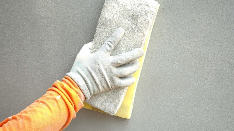 Gloved hand with sponge