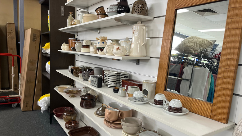 Vintage dishware on shelves in store