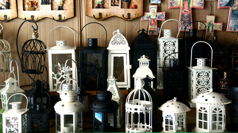An assortment of lanterns in a thrift shop