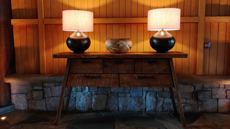 A set of vintage lamps on an entryway table