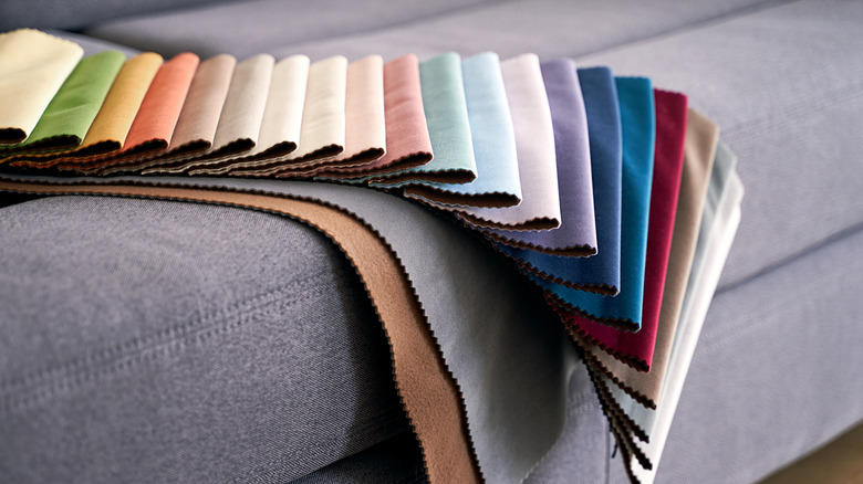 Upholstery swatches on the arm of a gray sofa
