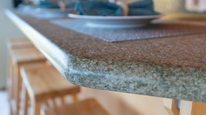 A granite kitchen countertop with curved edges.