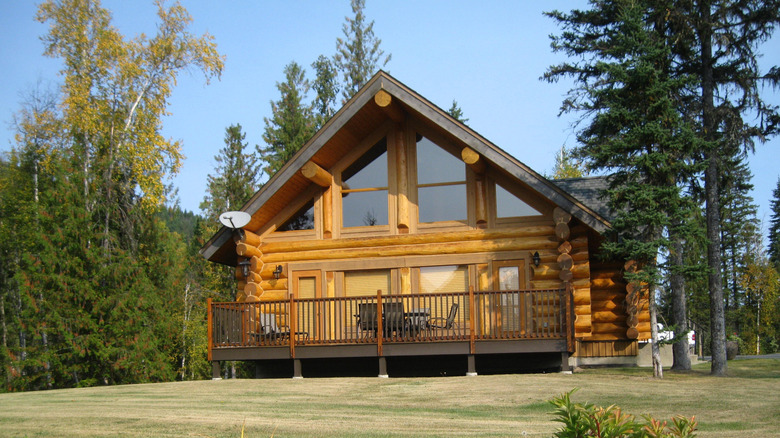 wide shot of a modern log cabin