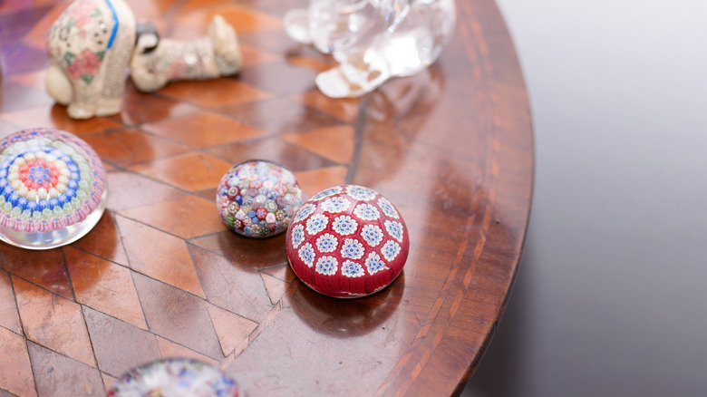 Paperweights arranged on top of a wooden table