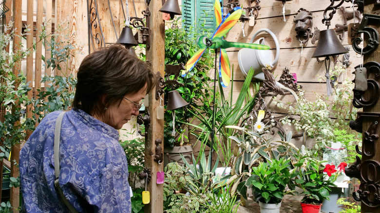 woman shopping antique garden items