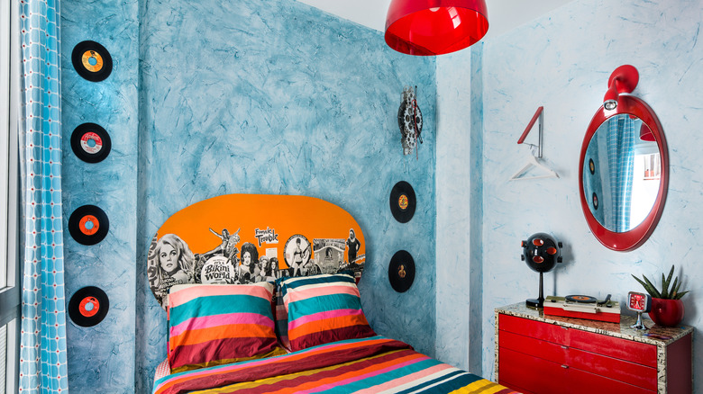 A 1960s bedroom with bright colored furniture and decor