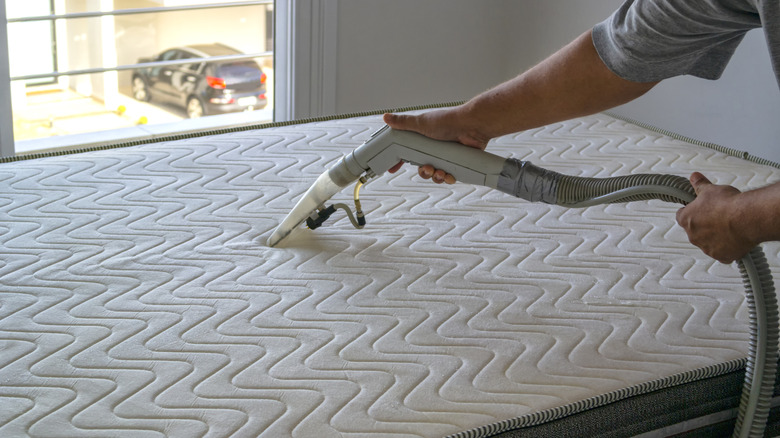 vacuuming mattress with attachment