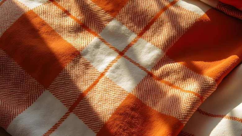 Plaid flannel blanket in sun