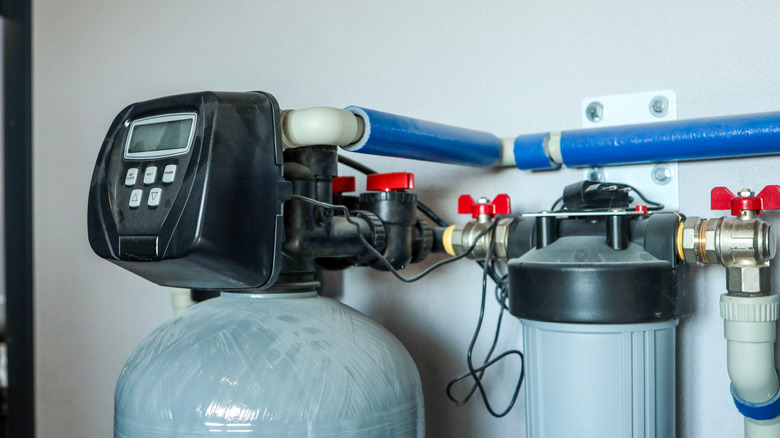 A home water filtration system connected inside of a house