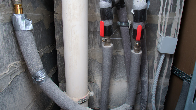 Plumbing lines with insulation on them