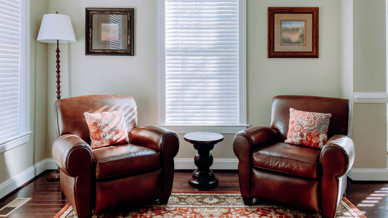Two matching leather arm chairs.