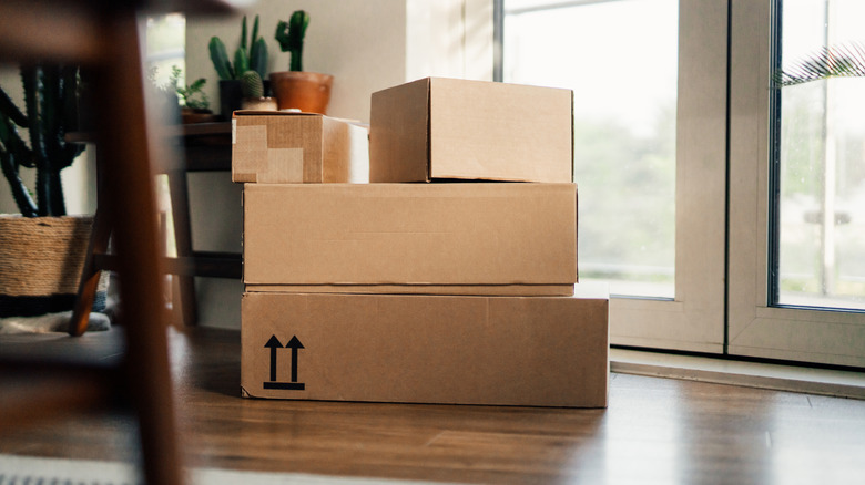 A stack of packages near a door