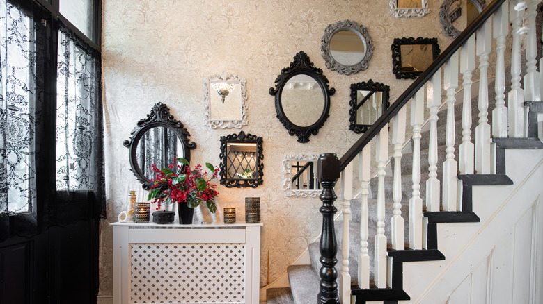 An entryway with lots of wall art