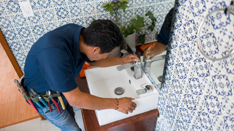 Man installing basement bathroom