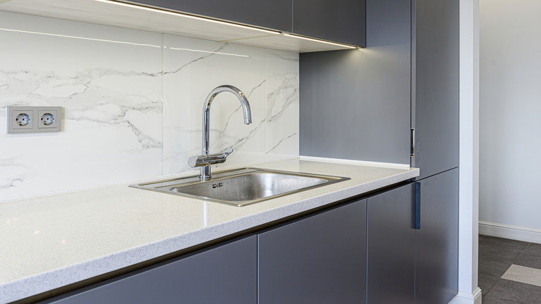 White stone kitchen counter with a pencil edge