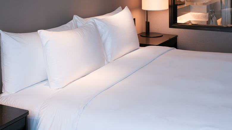 Bed with crisp white pillows