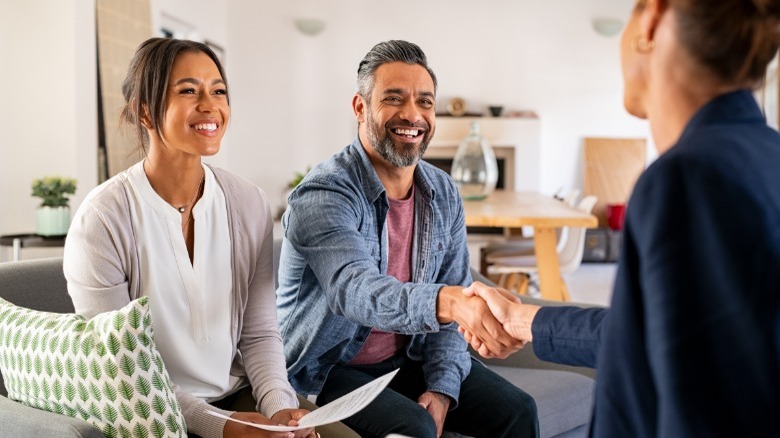 Young couple meeting realtor 