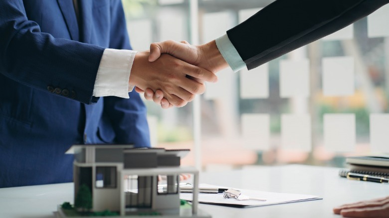 Men shaking hands home finance