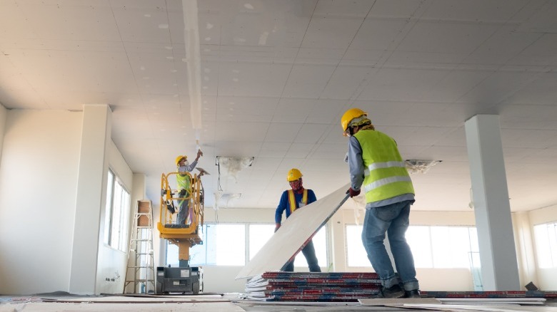 Men performing extensive home repairs 