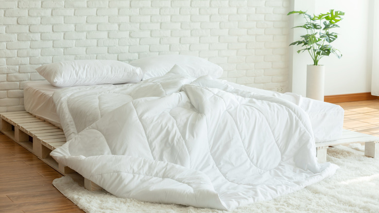 duvets and pillows on bed