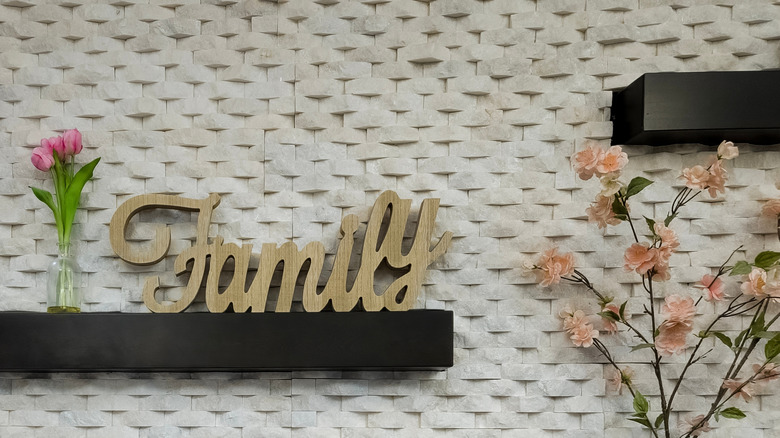 Wooden word art decor on a shelf