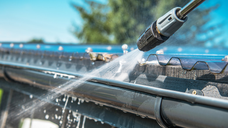 pressure washer on gutter