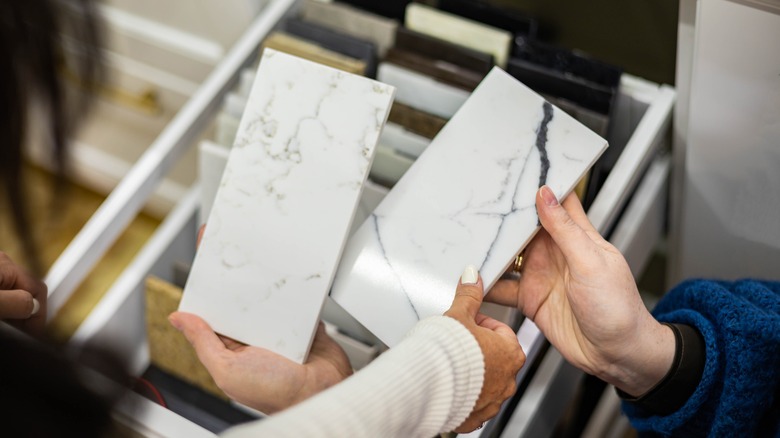 Person choosing countertop material