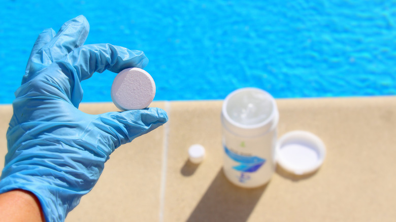 hand holding chlorine tablet 