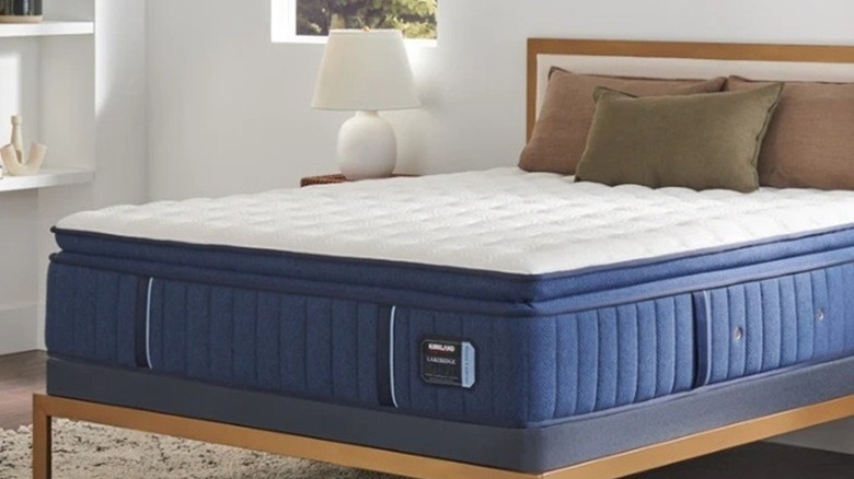 A Kirkland mattress on a bed frame
