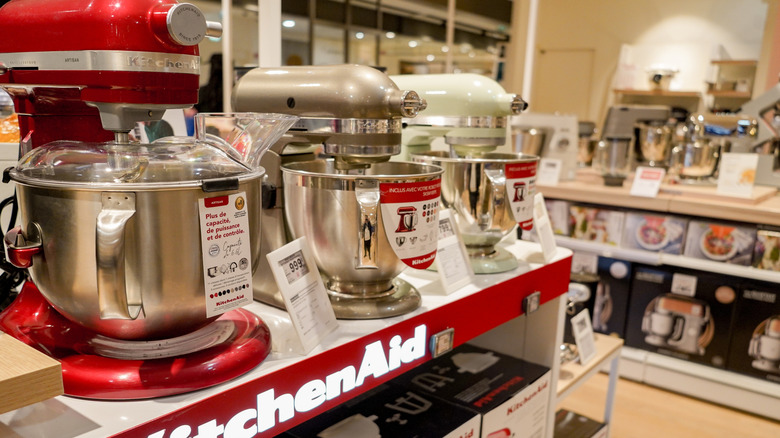 KitchenAid stand mixers on display at a store.