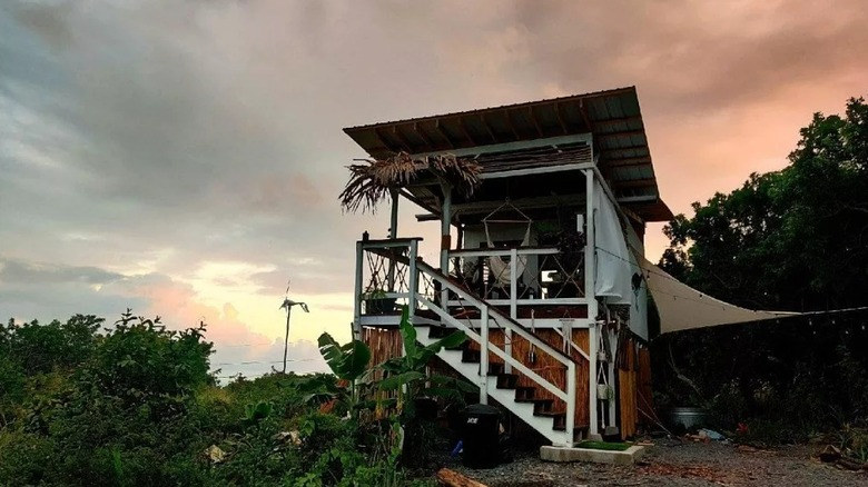 Tiny Hawaiian home at sunset