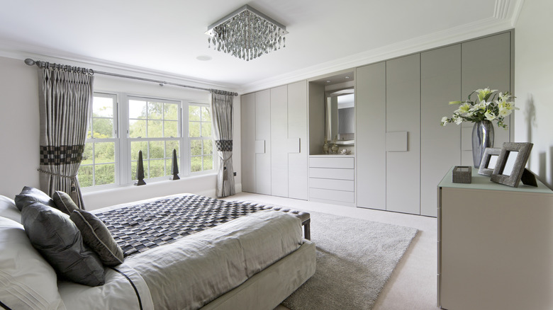 bedroom with grey and silver accent pieces