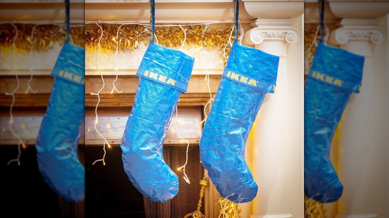 IKEA bag stockings hanging from a fireplace mantle
