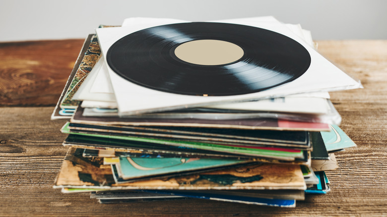 A stack of vinyl records piled on top of each other.