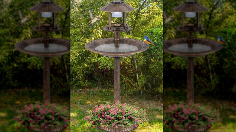 Giantex bird feeder, bird bath, and solar light combo product outside