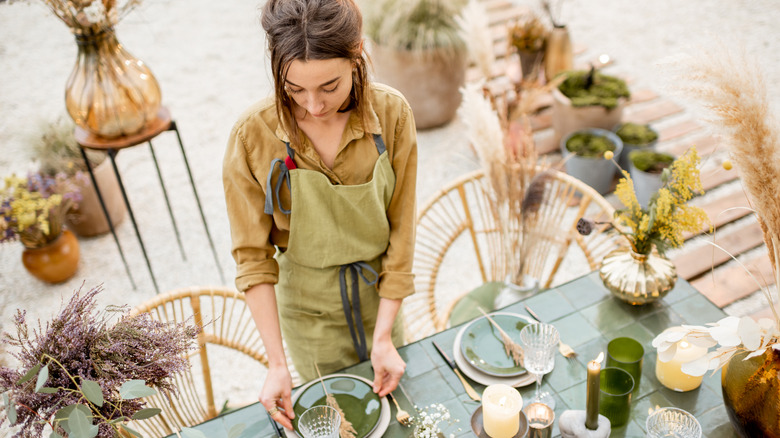 woman preparing yard for party