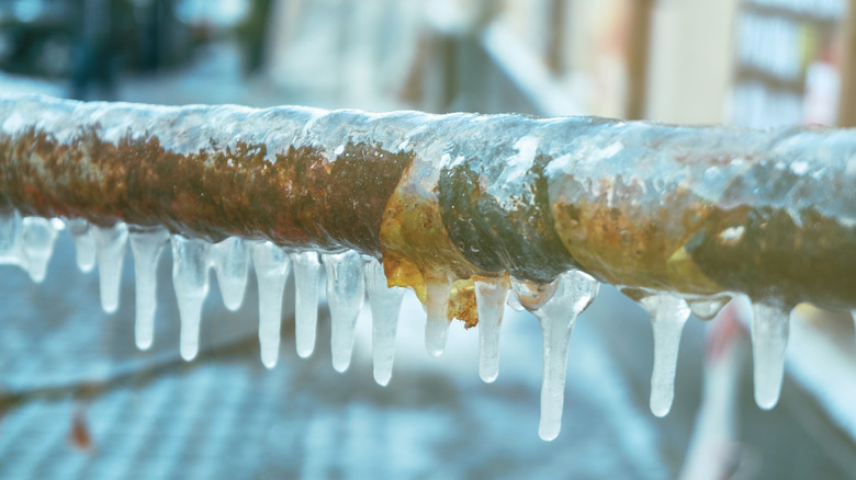 Frozen pipe with icicles