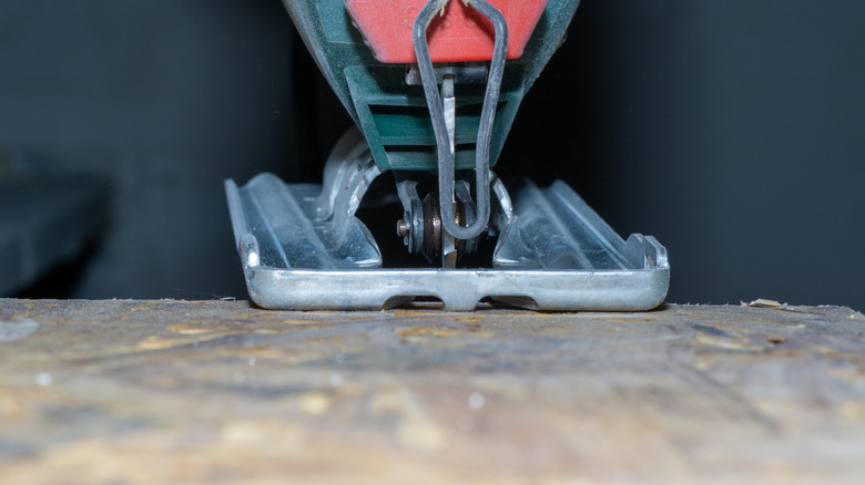 Jigsaw lined up to cut wood