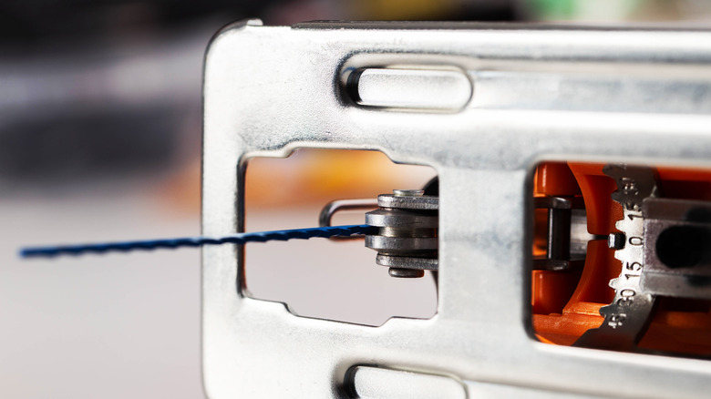 Close up of a jigsaw blade and shoe