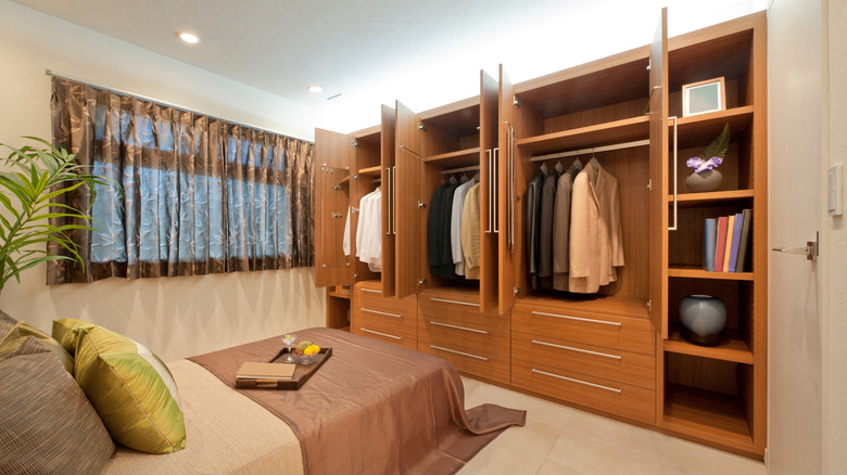 A bedroom with built in closets.