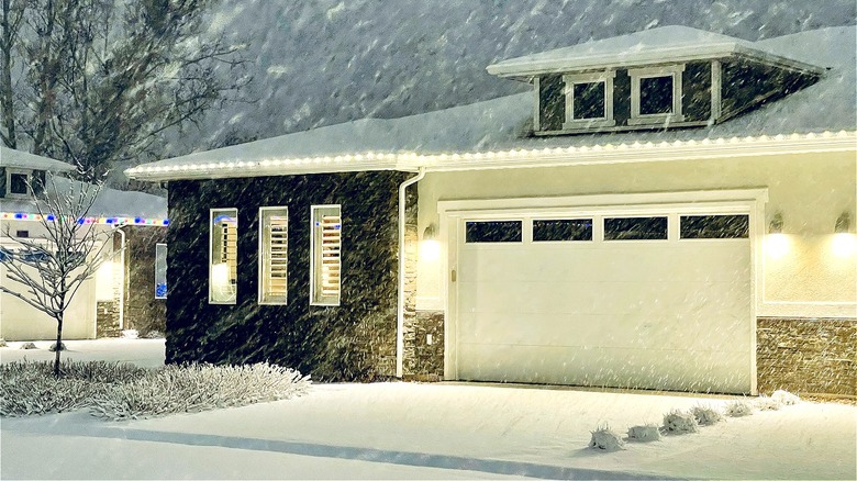 house during snowstorm at night