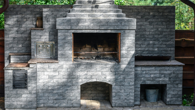 An outdoor kitchen made entirely from gray bricks