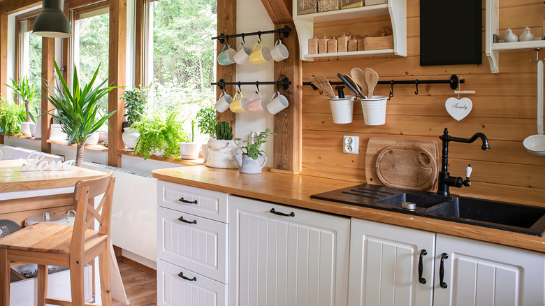 Kitchen with white beadboard cabinets