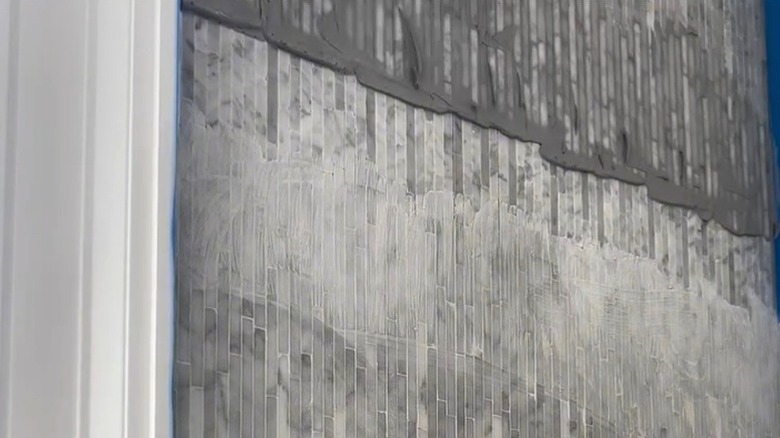 ombre grout technique on tiled shower wall