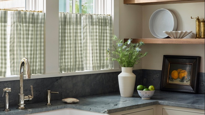 Kitchen with green gingham cafe curtains.