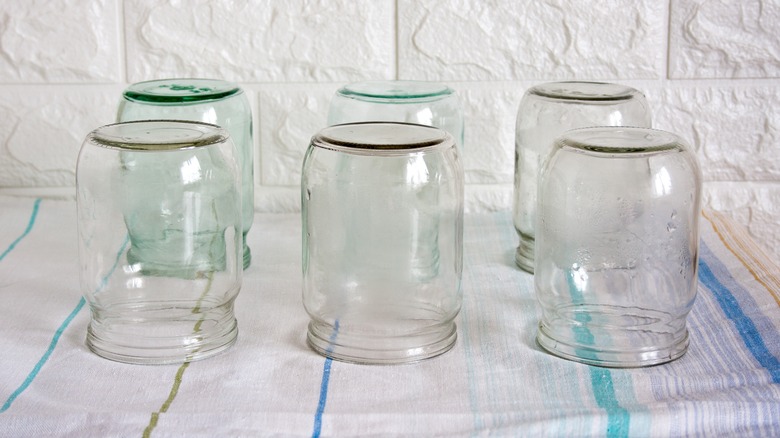 six empty glass jars 
