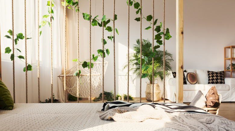 bedroom with rope room divider