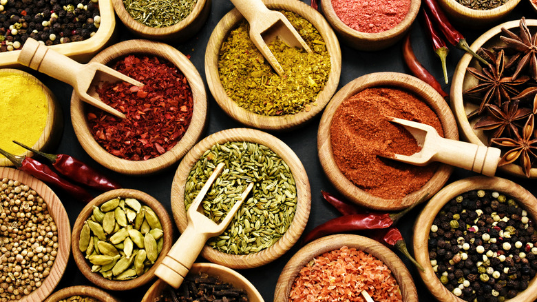 Containers of spices with scoops